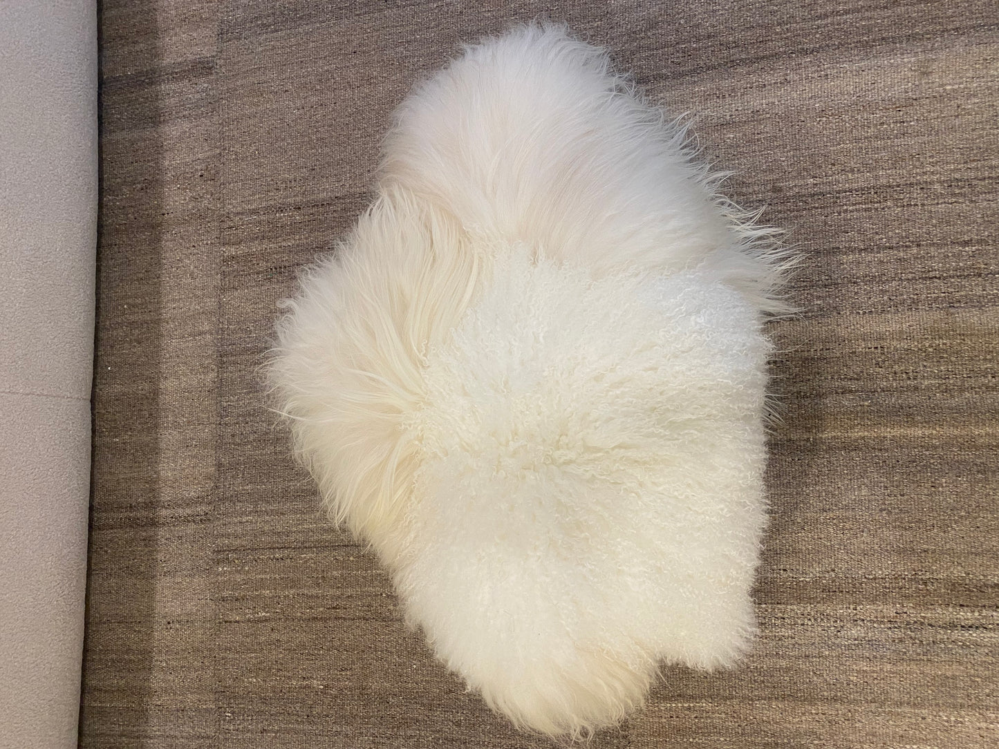 White pillow made by Carine Boxy