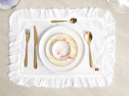 White frilled linen placemat